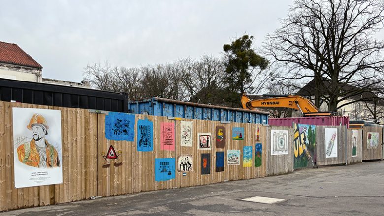 Bunte Bilder schmücken Bauzaun